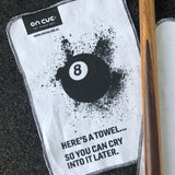 On Cue branded cue cleaning cloth with words "Here's a towel so you can cry into it later".